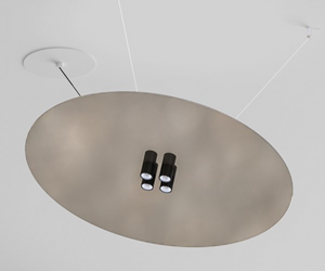 Designed by Davide Groppi For this project, a thin, circular mirror has been suspended in order to provide soft and soothing light. It combines direct and indirect illumination. Cartesio pays homage to one of the founders of modern optics. A sophisticated clamping system allows positioning of the circular mirror where you want, without needing wall or ceiling wires.  Actual product may vary from images shown on website. Please contact info@rifugiomodern.com  for finish samples. 