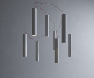 Designed by Davide Groppi  Simbiosi is all about re-thinking the idea of a chandelier. It’s a chandelier that has been de-structured and that can be re-assembled according to the aesthetic taste of the user. It’s a kind of conjuring trick that gives you the possibility of connecting the diodes in series using very weak electric currents so as to have wires that are practically invisible. 