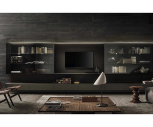 Is a new conception of the living room system. The design consists of a back panel in lacquered glass, a pure surface with light and reflections, which holds storage units made entirely of glass including drawers and sliding doors, extremely thin shelves and display cases with flap.  Actual product may vary from images shown on website. Please contact info@rifugiomodern.com for finish and fabric samples.
