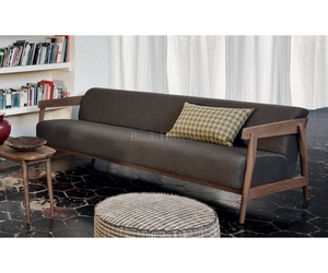 Designed by Paola Navone for Gervasoni  Two-seater sofa in solid natural Canaletto walnut, bleached oak or oak lacquered in white, grey, black, ocean or dove-grey, Brick 309 has the seat and back softened by a single cushion padded in polyurethane foam with a removable cover. The different wooden elements that make up the structure are clear, inclined and superimposed.  Actual product may vary from images shown on website. Please contact info@rifugiomodern.com for finish and fabric samples.