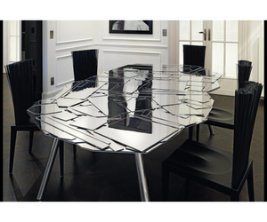 Designed by fernando e Humberto Campana for Edra  A mosaic of mirror shards characterizes this table with irregular top, available in different sizes. The structure is composed of metal legs inclined to hold up an aluminum sheet top that forms the basis for the layout of the mosaic. The shards are in mirrored metachrylate.  Actual product may vary from images shown on website. Please contact info@rifugiomodern.com for fabric and finish samples.