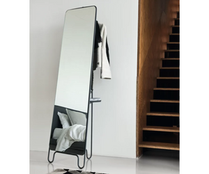Designed by Paola Navone for Gervasoni  LC 198 is a rectangular free-standing mirror, with a structure in white or grey painted steel rod with a matte finish. The steel structure curves into the feet creating a product with sinuous shapes and incorporates a shelf in natural, black, white, grey, ocean or dove-grey Canaletto walnut to increase its functionality.  Actual product may vary from images shown on website. Please contact info@rifugiomodern.com for finish and fabric samples.