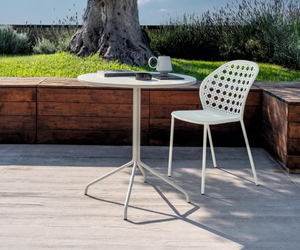 Brisa Outdoor furniture is available at Rifugio Modern. The pleasure of outdoor dining interpreted in many different ways: the Brise table group suggests new ways of thinking about the outdoor table, whether for many guests or a few close friends.