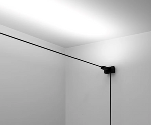 Designed by Davide Groppi  Wall lamp Length divisible Standard versions at 6 / 12 metres in length   Infinito is a spatial concept; it is continuous light. A thin strip made of stainless steel a mere 18 mm in width “cuts” the space to produce indirect light. It is possible to adapt Infinito to various situations, stretching it from wall to wall or ceiling to floor, according to one’s taste or needs. Infinito: essence and absence.  Infinito is   info@rifugiomodern.com  for finish samples.