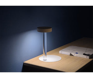 Davide Groppi Design Methacrylate - Metal table lamp with transparent stem and magnetic fixing  This is an evolution of our TeTaTeT lamp. We have put into use a rechargeable Lithium battery that allows the support column of the lamp to be practically “invisible”. RECHARGEABLE LITHIUM BATTERY 3,7 V DC - BATTERY LIFE NINE HOURS - USB C LED 2 W Actual product may vary from images shown on website. Please contact info@rifugiomodern.com  for finish samples. 
