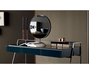 Designed by Carlo Colombo for Gallotti&Radice Desk-vanity in wood covered in 6mm tempered glass and with shelf in 10mm tempered glass, both back-painted in the colors of the samples, in the bright or satin version. Double-sided mirror diam. 50cm, adjustable (360 °). On request insert with magnifying mirror.  Actual product may vary from images shown on website. Please contact info@rifugiomodern.com  for finish and fabric samples.