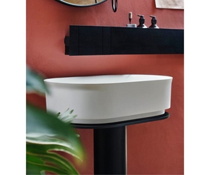 Designed by Neri & Hu for Agape The Immersion washbasin, with a matt black-coated floor-standing metallic support, is the ideal complement for the bathtub of the same name, inspired by the tradition of oriental timber bathing vessels. The compact size of this washbasin makes it suitable for confined living spaces as well.  Actual product may vary from images shown on website. Please contact info@rifugiomodern.com for fabric and finish samples.
