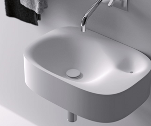 Designed by Andrea Morgante (Shiro Studio) for Agape The Nivis washbasin consists of two interconnected cavities, with water running from the main, larger and deeper cavity to the smaller one which has an overflow outlet hole.  Actual product may vary from images shown on website. Please contact info@rifugiomodern.com for fabric and finish samples.