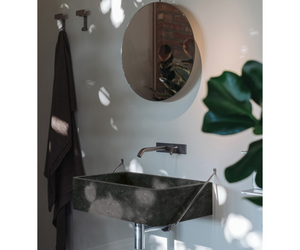 Designed by Benedini Association for Agape From white Carrara marble, an eternal material of art and architecture, comes this washbasin with a large basin and thin edges, supported by a stainless steel structure. Together with the other elements of the Agape collection Actual product may vary from images shown on website. Please contact info@rifugiomodern.com for fabric and finish samples.
