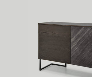 Refined and adaptable, the Grafica sideboard ideally complements the living room or bedroom is an ideal complement for both living room or bedroom. It is available in a number of compositions and a wide range of finishes to meet the most diverse needs. Actual product may vary from images shown on website. Please contact info@rifugiomodern.com for finish and fabric samples.