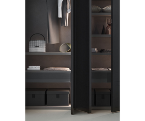 Aesthetic minimalism and functionality are an unbeatable combo. This wardrobe’s success lies in its consistent simplicity and in the power of its minimal lines. Tratto integrates and blends the door parts while carving the handle out of the panel. Vertically recessed near the edge of the door, it offers a sound grip on both hinged and sliding doors. Actual product may vary from images shown on website. Please contact info@rifugiomodern.com for finish and fabric samples.