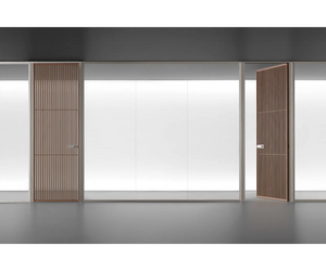 Glass partition wall system, always custom made, providing linear, corner and terminal solutions for the internal organization of domestic, public, or professional environments. The versatile design of Spazio is underlined by the free combination with sliding doors and Moon, Sail and Zen  Actual product may vary from images shown on website. Please contact info@rifugiomodern.com for finish and fabric samples.