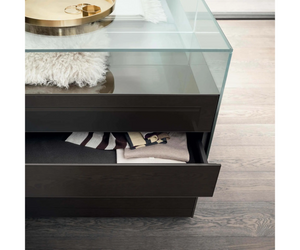 A double-sided display system available in various dimensions, designed for home settings, as well as walk in closets or public spaces. Realized in transparent glasses in the upper part and lacquered in the front. Dolmen combines drawers with push and pull opening and lacquered open modules.  Actual product may vary from images shown on website. Please contact info@rifugiomodern.com for finish and fabric samples.