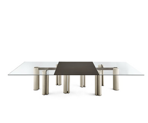 Designed by Pinuccio Borgonovo Table with 12mm tempered glass top, available in extralight, smoked “Grigio Italia” or painted with the exclusive antique bronze and lead finish. Bases in lightened concrete in the colour ivory or charcoal.  Metal parts lacquered in the “fango” colour. Actual product may vary from images shown on website. Please contact info@rifugiomodern.com  for finish samples.