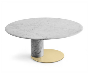Designed by Oscar e Gabriele Buratti Table with top and base in natural polished Bianco Carrara Gioia marble or honed mat Nero Marquinia marble. Glossy brass-plated metal bottom plate. Marble rotating plate in the same finish of the top resting on the top, on request. Actual product may vary from images shown on website. Please contact info@rifugiomodern.com  for finish samples. 