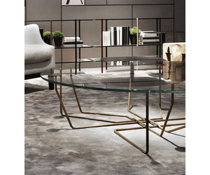 Designed by Massimo Castagna Coffee table with extralight glass. Structure in hand burnished brass. The hand burnished brass finish looks naturally spotted and irregular. Due to this craftmade processing, each product is unique and exclusive. Actual product may vary from images shown on website. Please contact info@rifugiomodern.com  for finish samples.