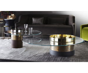 Designed by Massimo Castagna Coffee table with 10mm extralight tempered glass top. 10 mm tempered smoke "Grigio Italia" glass, on request. Black or white open pore stained ash or rust lacquered wooden base. Central cylinder in bright brass-plated, hand-burnished, copper-plated, black chromed, white lacquered or bright nickel-plated metal.  Actual product may vary from images shown on website. Please contact info@rifugiomodern.com  for finish samples.