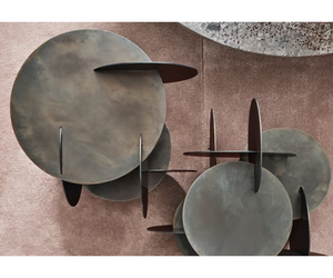 Designed by Massimo Castagna Coffee table in hand burnished metal. The metal looks naturally spotted and irregular. Due to this craftmade processing, each product is unique and exclusive.  Inches (W x D x H) A 18¾" x 19" x 20 " B 20½" x 21¾" x 18¾"  Actual product may vary from images shown on website. Please contact info@rifugiomodern.com  for finish samples.