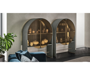 Designed by Draga & Aurel  Sideboard with “elephant grey” lacquered wooden structure. 6mm tempered glass door with pigmented amber color. Back and shelves in 6mm tempered smoked “grigio Italia” glass. Details in satin brass.  Inches (W x D x H) 49¼" x 17¾" x 67"  Actual product may vary from images shown on website. Please contact info@rifugiomodern.com  for finish samples