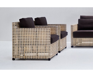 Designed by Paola Navone for Gervasoni  A structure with squared lines but of great visual lightness characterises the family of WK armchairs, available in two different seat depths. A proposal with a charm that is both classic and exotic, with a beech structure covered with a texture made with interweaving of natural parchment, featuring soft loose seat and back cushions.  Actual product may vary from images shown on website. Please contact info@rifugiomodern.com for finish and fabric samples.