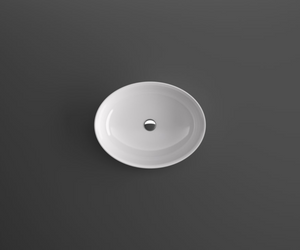 Designed by Benedini Association for Agape  Made of white Ceramilux®, a modern and resistant composite material, the 661 countertop washbasin has an oval shape and a deep basin, with a high and thin edge. Available in glossy or matte finish.  Actual product may vary from images shown on website. Please contact info@rifugiomodern.com for fabric and finish samples.