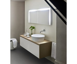 Designed by Benedini Association for Agape  Made of white Ceramilux®, a modern and resistant composite material, the 661 countertop washbasin has an oval shape and a deep basin, with a high and thin edge. Available in glossy or matte finish.  Actual product may vary from images shown on website. Please contact info@rifugiomodern.com for fabric and finish samples.
