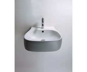 Designed by Patricia Urquiola for Agape  Soft yet clean lines, inspired by nature, for this collection of Pear, available in glossy or matt white ceramic or two-colour. The two-colour version, white inside and dark grey outside, gives the bathroom an almost “optical” look. The ceramic washbasin completes the sanitary ware range.  Actual product may vary from images shown on website. Please contact info@rifugiomodern.com for fabric and finish samples.