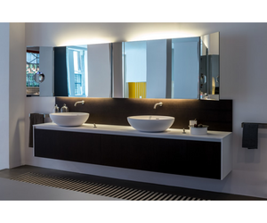 Designed by Benedini Association for Agape  Made of white Cristalplant® biobased, the Spoon and Spoon XL washbasins can give life to multiple compositional possibilities: for example in the countertop version on a Flat XL oak top. The enlarged shapes of Spoon XL maintain its essential and enveloping elegance unaltered.  Actual product may vary from images shown on website. Please contact info@rifugiomodern.com for fabric and finish samples.