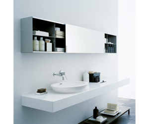 Designed by Benedini Association for Agape  Made of white Cristalplant® biobased, the Spoon and Spoon XL washbasins can give life to multiple compositional possibilities: for example in the countertop version on a Flat XL oak top. The enlarged shapes of Spoon XL maintain its essential and enveloping elegance unaltered.  Actual product may vary from images shown on website. Please contact info@rifugiomodern.com for fabric and finish samples.