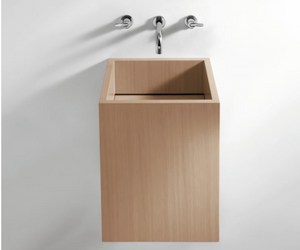 Designed by Benedini Association for Agape Solid shape and natural warmth for Cube, a plywood washbasin realised in natural, brown or dark oak or in reconstituted wood, with teak finish. The large side surfaces show off the grain of the wood. Actual product may vary from images shown on website. Please contact info@rifugiomodern.com for fabric and finish samples.