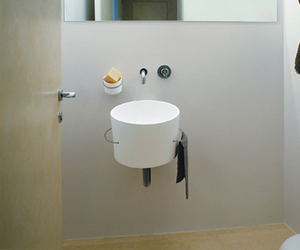 Designed by Fabio Bortolani & Ermanno Righi for Agape Subtle irony and intelligent functionality for the Bucatini white ceramic washbasin, equipped with lateral towel rails in steel cable covered in white, black or transparent plastic. Bucatini can be complemented by a line of coordinated accessories. A complete program to furnish the bathroom with a unique style. Actual product may vary from images shown on website. Please contact info@rifugiomodern.com for fabric and finish samples.