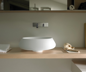 Designed by Angelo Mangiarotti for Agape Fruit of an idea conceived by Angelo Mangiarotti, Bjhon 2 can be placed anywhere you like, thanks to the drain integrated into the column, and the possibility of fitting it on the countertop. It fits in seamlessly in innumerable different styles and settings, in both versions of the basin, and in both materials Actual product may vary from images shown on website. Please contact info@rifugiomodern.com for fabric and finish samples.