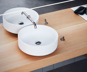 Designed by Angelo Mangiarotti for Agape Bjhon washbasins are the fruit of an idea conceived by Angelo Mangiarotti in 1970. They are made of marble bianco di Carrara, grigio Carnico, nero Marquina or using an advanced technological material: Cristalplant® biobased. Actual product may vary from images shown on website. Please contact info@rifugiomodern.com for fabric and finish samples.