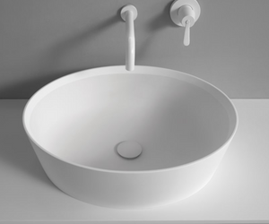 Designed by Benedini Association for Agape Made of white Ceramilux®, a modern and resistant composite material, the 661 countertop washbasin has an oval shape and a deep basin, with a high and thin edge. Available in glossy or matte finish. Actual product may vary from images shown on website. Please contact info@rifugiomodern.com for fabric and finish samples.