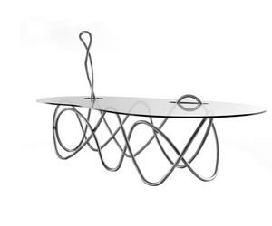 Designed by Jacopo Foggini for Edra Inspired by the dynamics of a musical movement, it has a unique and irregular shape. Crystal and metal tube are the natural selection for the most suitable materials to create this unique table. The structure is formed by the interlocking of two systems of metal tubing masterfully curved by manual instruments that support the glass tabletop. Actual product may vary from images shown on website. Please contact info@rifugiomodern.com for fabric and finish samples.