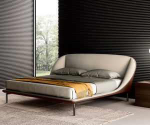 Designed by Simone Bonanni As a tribute to Sunday, the day of rest, the Domenica bed invites you to relax and recline in a solid, warm and protective embrace. Allow 4-6 weeks for delivery  Actual product may vary from images shown on website. Please contact info@rifugiomodern.com for finish and fabric samples.